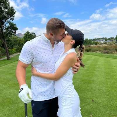 Demi-Leigh Tebow and her husband Tim Tebow shared a passionate kiss on a golf court.